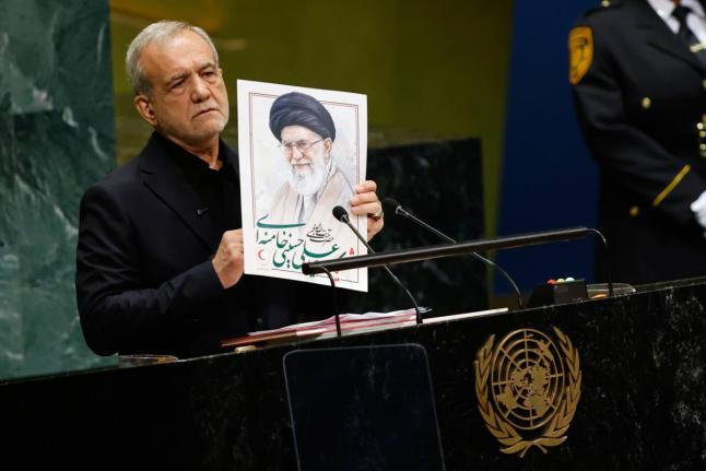 Iran’s President Masoud Pezeshkian holds an image of late Iranian Supreme Leader Ayatollah Ali Khamenei during the 81st session of the United Nations General Assembly at United Nations headquarters, Wednesday.