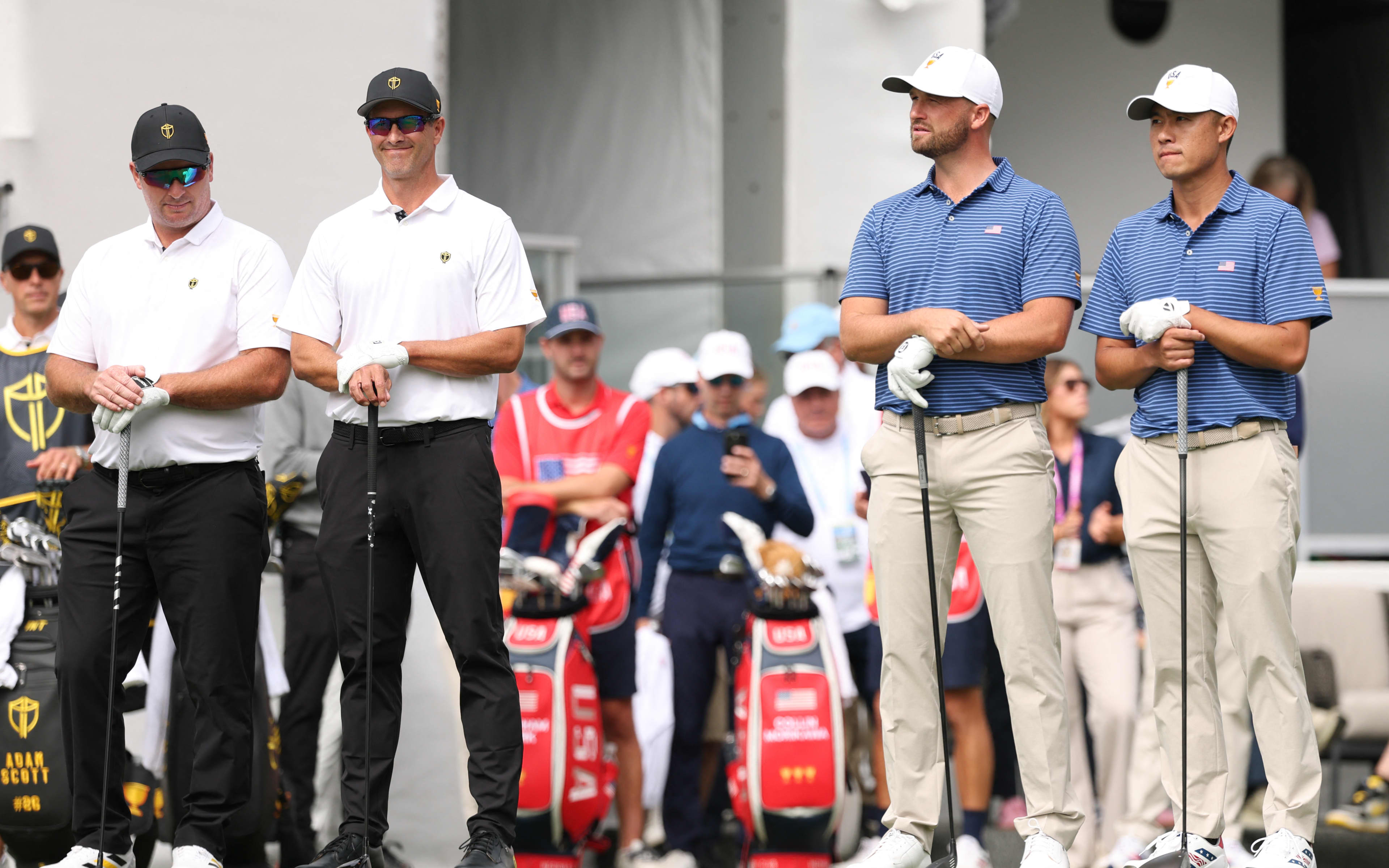 From left, Ryan Fox of New Zealand and Adam Scott of Australia line up for the International Team ahead of their Presidents Cup four-ball match against USA pair Wyndham Clark and Collin Morikawa.