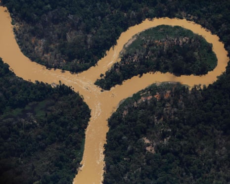 Aerial view of the Mucajai river winding through rainforest in the Yanomami territory, Brazil.