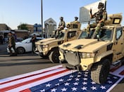 Iraq’s PM orders probe after US flag trampled by Iran-backed militias