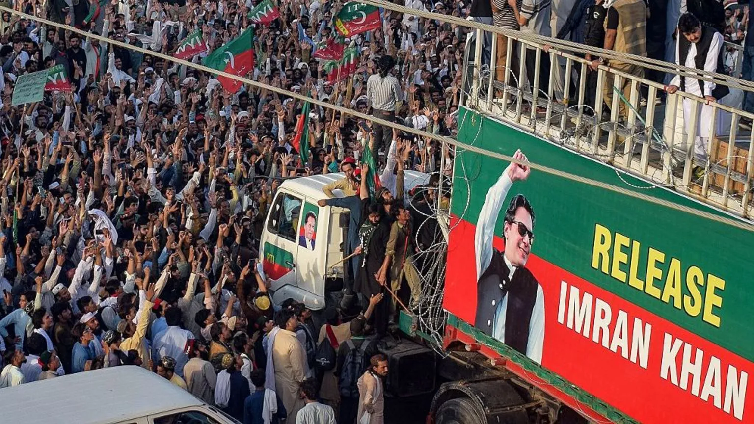 Getty Images Some 5,000 people took to the streets on Sunday carrying red and green flags of Khan's Pakistan Tehreek-e-Insaf party