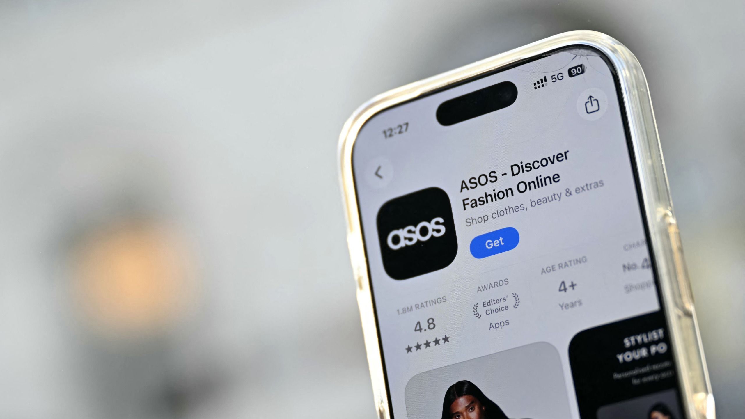 A phone showing the ASOS app download page